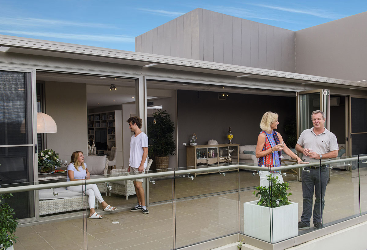 sun room opens to patio for entertainment