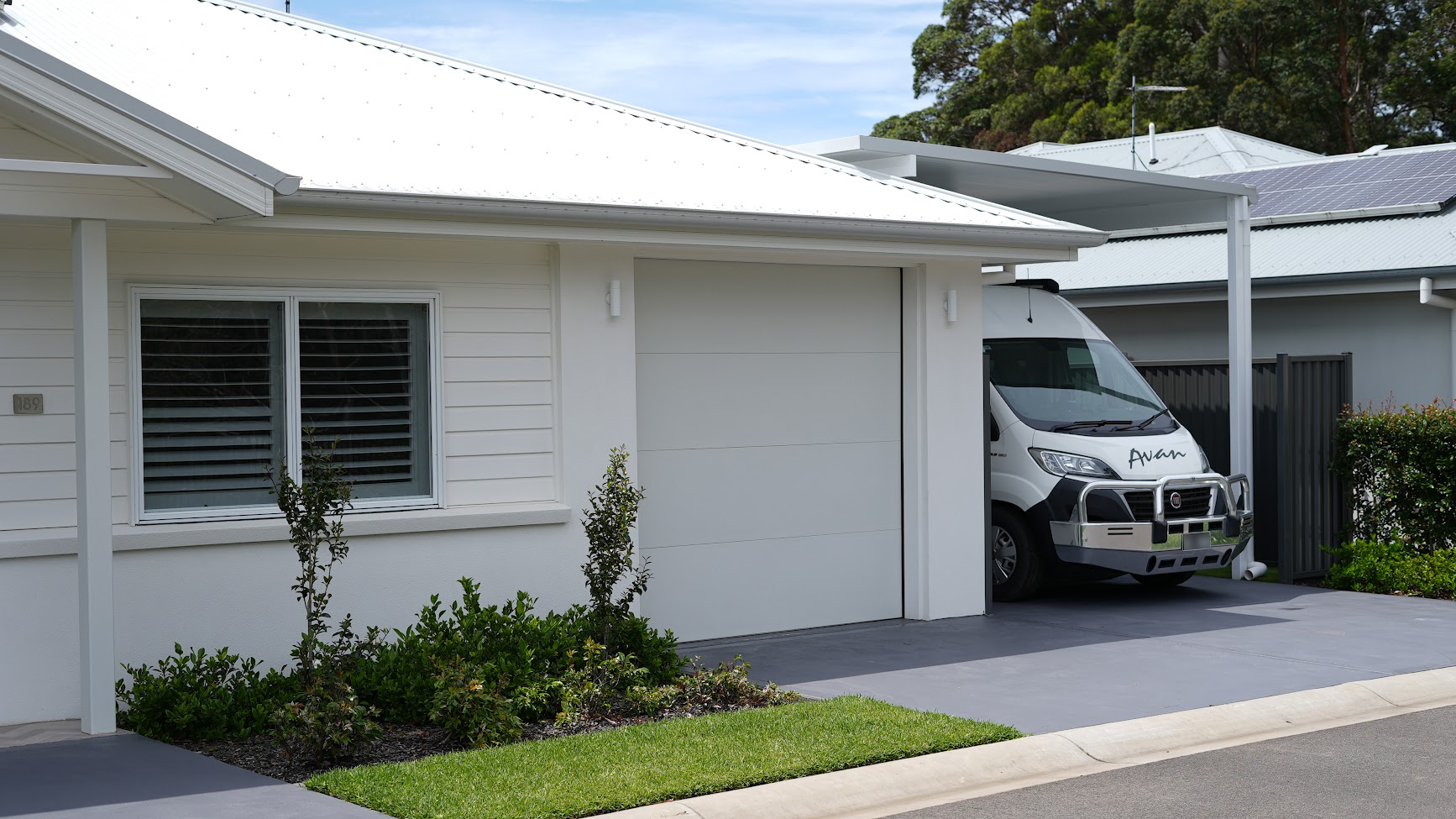 A stylish, custom-built caravan garage by Spanline, thoughtfully designed to seamlessly blend with the existing property.
