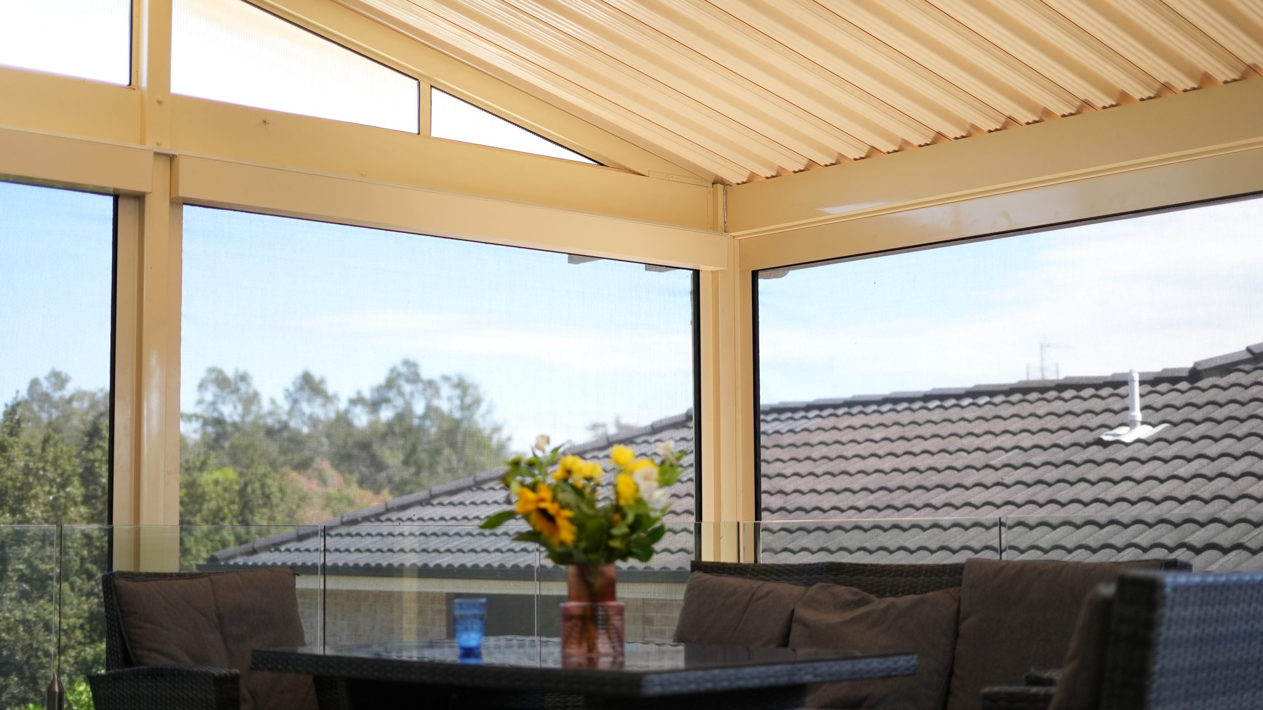 A light filled sunroom with patio roof panels