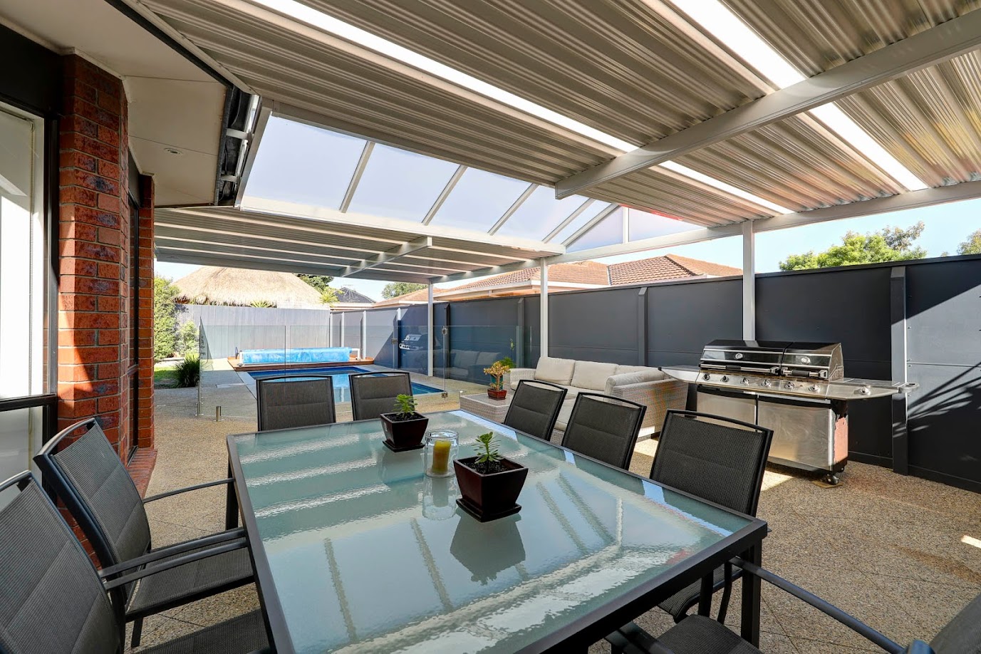 outdoor room with transparent roof panels to let sunlight in